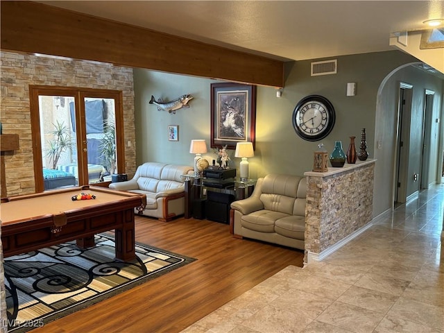 2975 Montessouri St, Las Vegas, NV 89117 - living area featuring arched walkways and wood finished floors