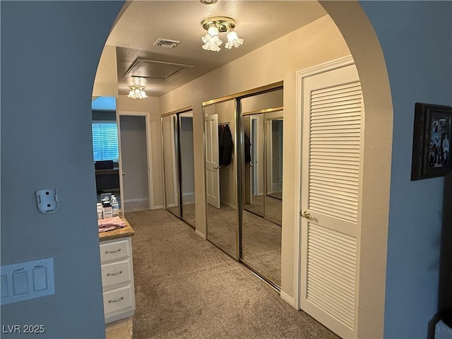 2975 Montessouri St, Las Vegas, NV 89117 - hallway featuring light carpet and arched walkways