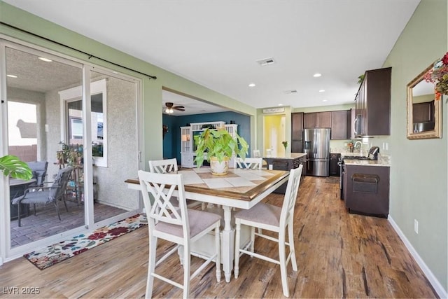 9305 Briar Bridge Ave, Las Vegas, NV 89148 - dining room with wood finished floors and recessed lighting