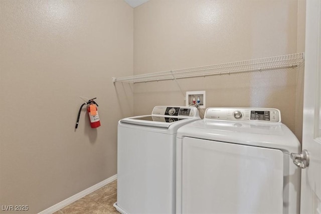 9305 Briar Bridge Ave, Las Vegas, NV 89148 - washroom featuring washer and clothes dryer and light tile patterned flooring