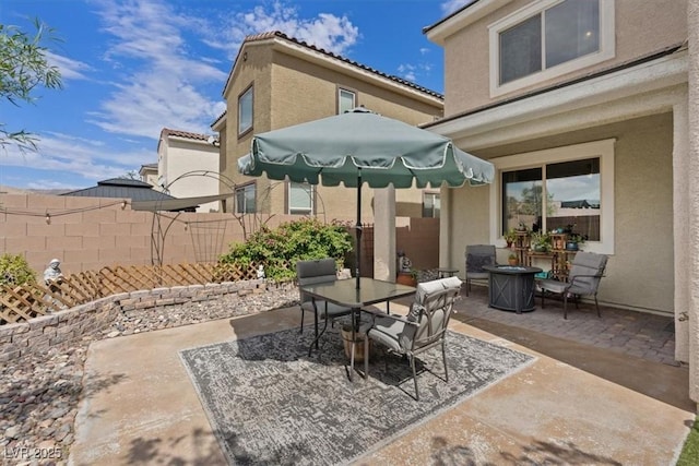 9305 Briar Bridge Ave, Las Vegas, NV 89148 - view of patio featuring outdoor dining area and an outdoor fire pit