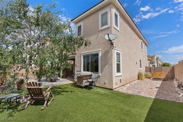 9305 Briar Bridge Ave, Las Vegas, NV 89148 - rear view of house featuring stucco siding and a patio area
