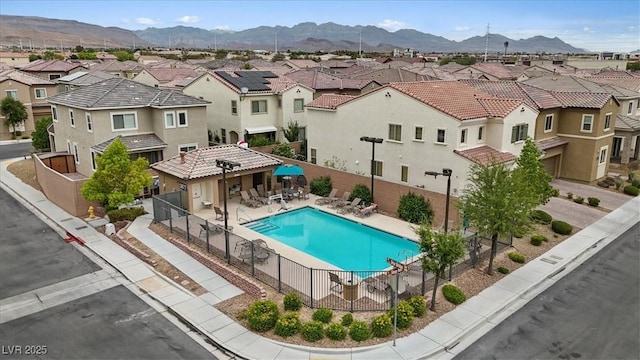 9305 Briar Bridge Ave, Las Vegas, NV 89148 - community pool featuring a residential view, a mountain view, and a patio area