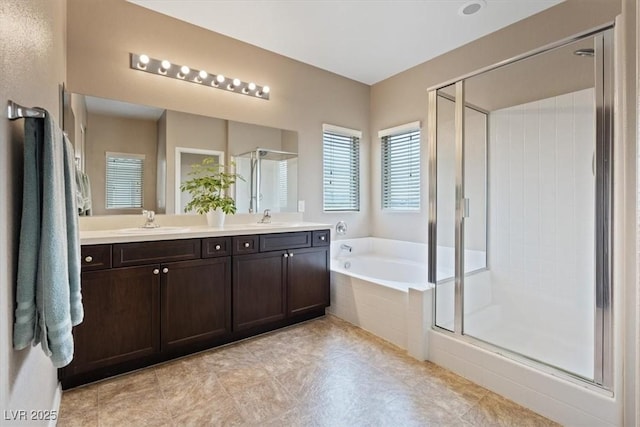 9305 Briar Bridge Ave, Las Vegas, NV 89148 - bathroom featuring a shower stall, a garden tub, and double vanity