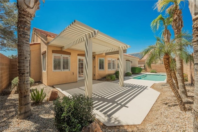 3882 Genoa Dr, Las Vegas, NV 89141 - back of house with stucco siding, a pergola, a fenced backyard, and a patio area