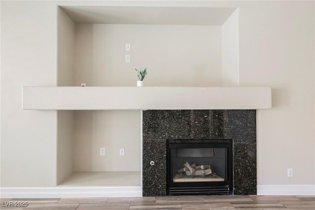 3882 Genoa Dr, Las Vegas, NV 89141 - detailed view of wood finish floors and a glass covered fireplace
