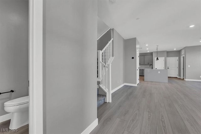 514 Fairview Hills St, Las Vegas, NV 89138 - unfurnished living room with stairway, light wood-type flooring, and recessed lighting