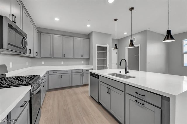 514 Fairview Hills St, Las Vegas, NV 89138 - kitchen featuring appliances with stainless steel finishes, gray cabinetry, light wood-style floors, and recessed lighting