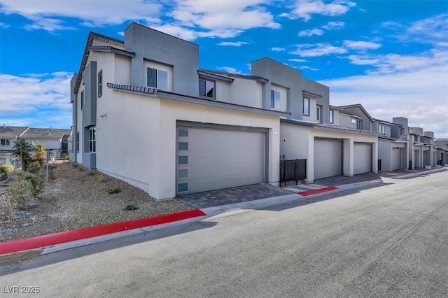 514 Fairview Hills St, Las Vegas, NV 89138 - view of front of house with a residential view, stucco siding, and an attached garage