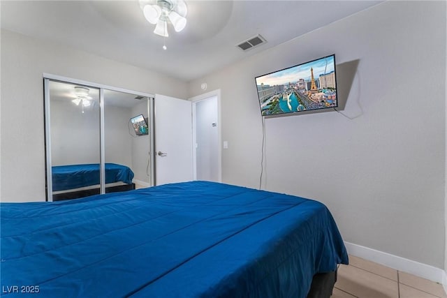 2690 Diamante Cir, Las Vegas, NV 89121 - bedroom with tile patterned flooring, ceiling fan, and a closet