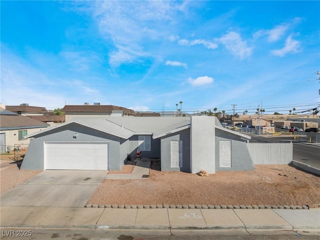 2690 Diamante Cir, Las Vegas, NV 89121 - view of front of property featuring a garage, stucco siding, and driveway