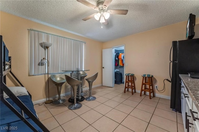 2690 Diamante Cir, Las Vegas, NV 89121 - dining space featuring a textured ceiling, ceiling fan, and light tile patterned floors