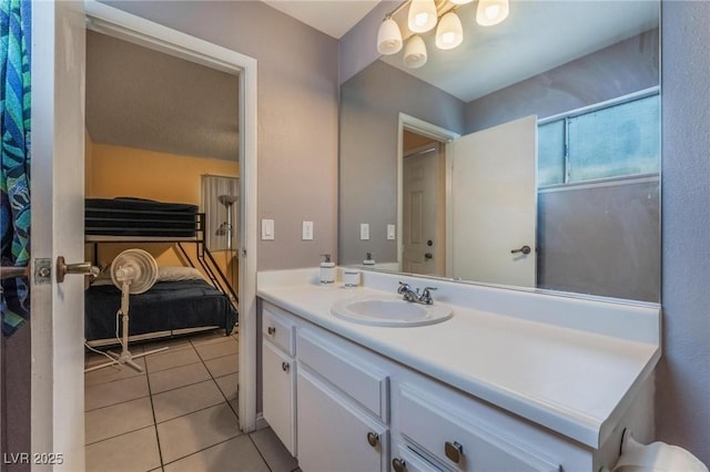 2690 Diamante Cir, Las Vegas, NV 89121 - bathroom featuring vanity, tile patterned flooring, and a chandelier