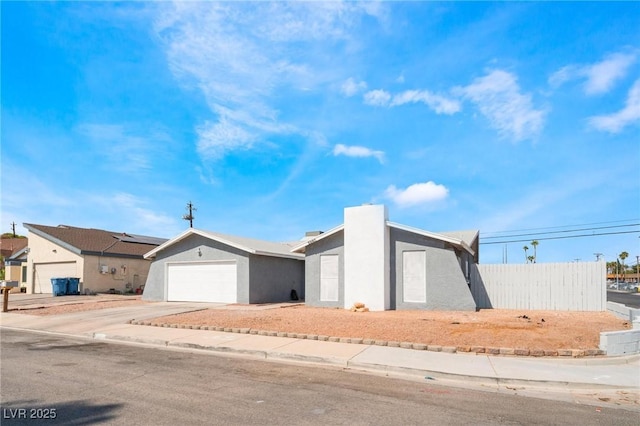 2690 Diamante Cir, Las Vegas, NV 89121 - view of front facade with stucco siding, driveway, and a garage