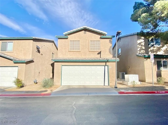 5266 Souvenir Ln, Las Vegas, NV 89118 - view of front of property featuring stucco siding and a garage