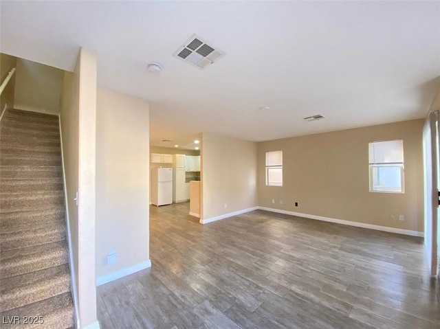 5266 Souvenir Ln, Las Vegas, NV 89118 - spare room featuring stairway, wood finished floors, and a smoke detector