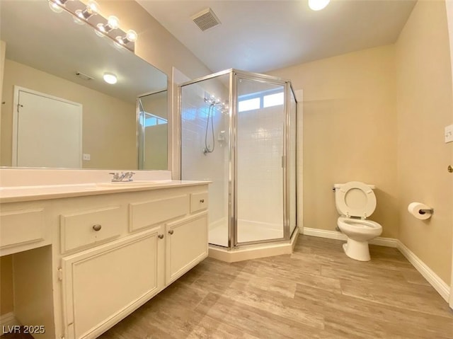 5266 Souvenir Ln, Las Vegas, NV 89118 - bathroom with vanity, a shower stall, and wood finished floors