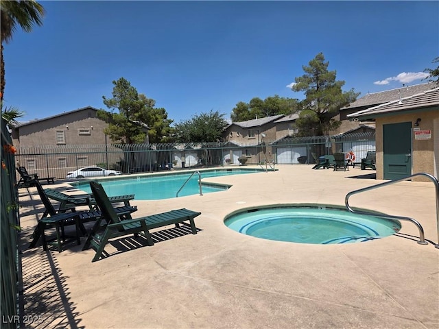 5266 Souvenir Ln, Las Vegas, NV 89118 - community pool with a community hot tub, a fenced backyard, and a patio area