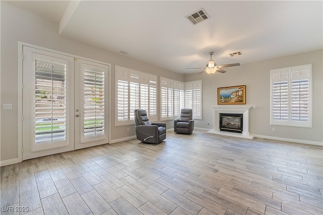 8424 Willowleaf Ct, Las Vegas, NV 89128 - living area with healthy amount of natural light, ceiling fan, and wood finished floors