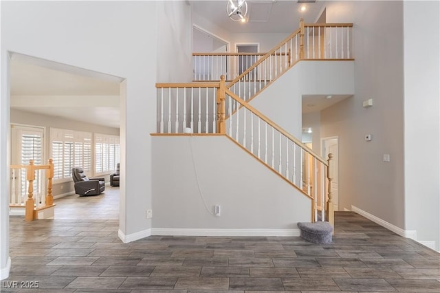 8424 Willowleaf Ct, Las Vegas, NV 89128 - staircase with wood finish floors and a towering ceiling