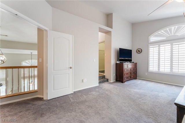 8424 Willowleaf Ct, Las Vegas, NV 89128 - unfurnished living room featuring carpet floors and baseboards