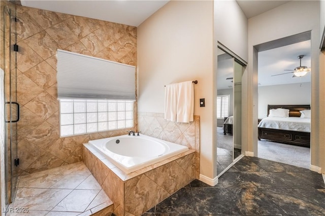 8424 Willowleaf Ct, Las Vegas, NV 89128 - full bathroom featuring connected bathroom, a bath, a ceiling fan, a shower stall, and marble look tiles