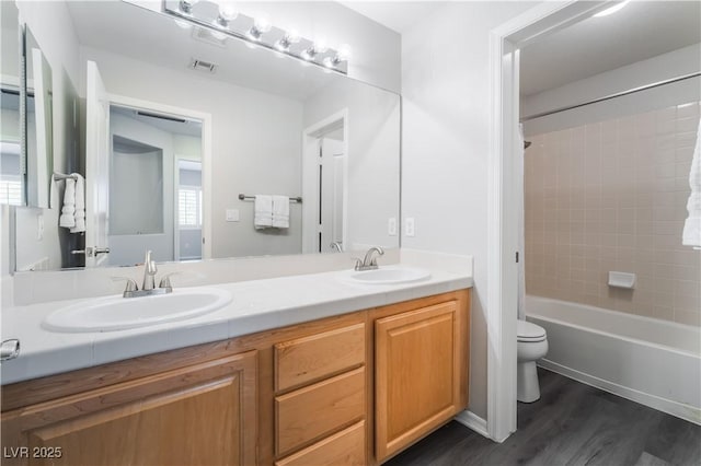 8424 Willowleaf Ct, Las Vegas, NV 89128 - full bath with double vanity, wood finished floors, and  shower combination
