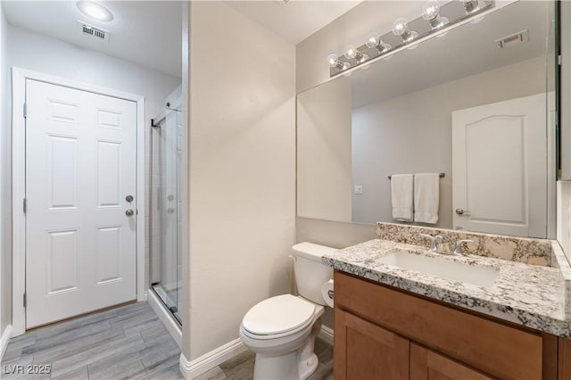 8424 Willowleaf Ct, Las Vegas, NV 89128 - full bath with vanity, a shower stall, and wood finished floors