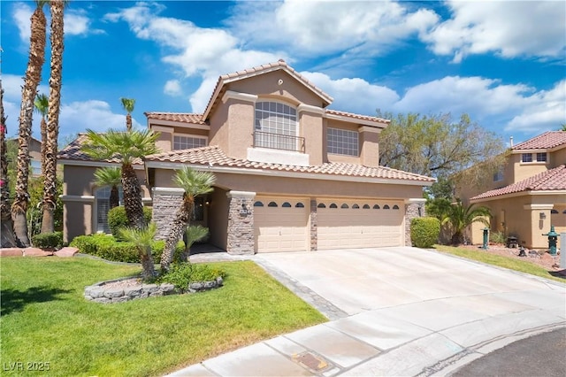 8424 Willowleaf Ct, Las Vegas, NV 89128 - mediterranean / spanish-style home with an attached garage, stucco siding, driveway, a front lawn, and stone siding