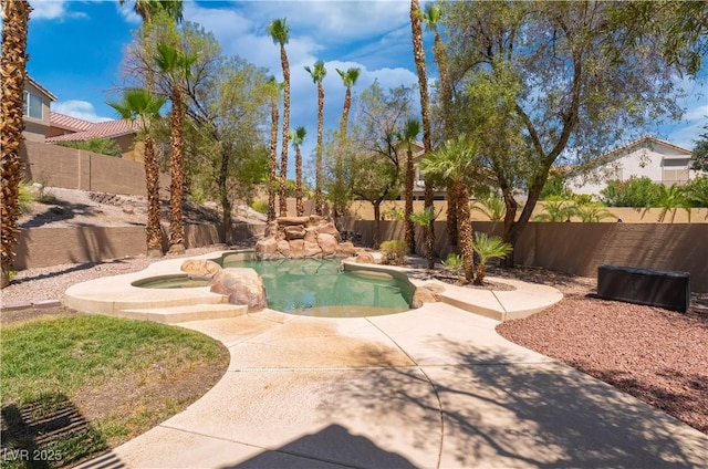 8424 Willowleaf Ct, Las Vegas, NV 89128 - view of pool featuring a fenced backyard, a patio area, and a pool with connected hot tub