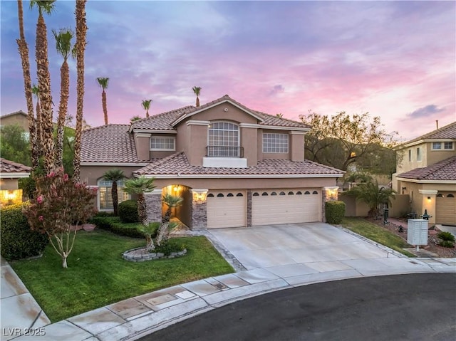 8424 Willowleaf Ct, Las Vegas, NV 89128 - mediterranean / spanish-style house with stucco siding, a garage, a front lawn, driveway, and a tile roof