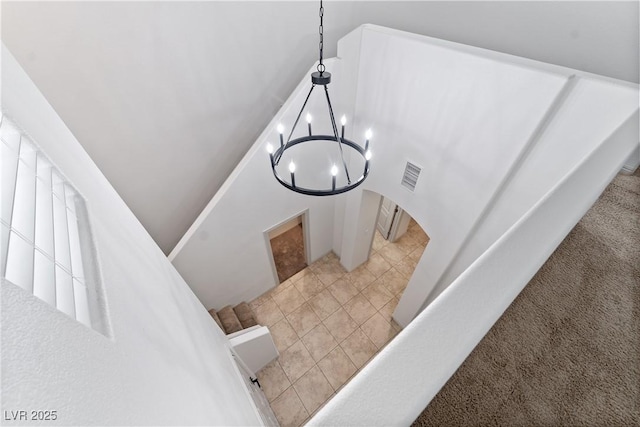 9217 Apollo Heights Ave, Las Vegas, NV 89149 - stairs with arched walkways and a chandelier
