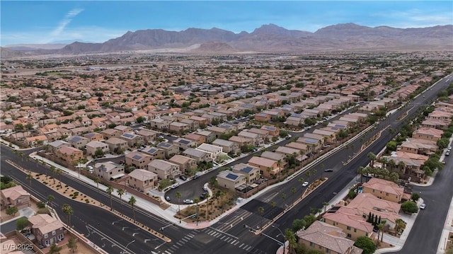 9217 Apollo Heights Ave, Las Vegas, NV 89149 - aerial overview of property's location featuring a mountain backdrop and nearby suburban area
