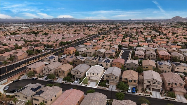 9217 Apollo Heights Ave, Las Vegas, NV 89149 - aerial view of property and surrounding area featuring a mountain backdrop and nearby suburban area