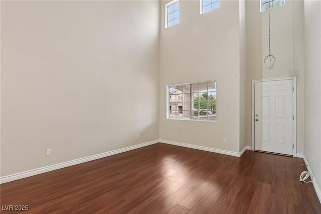 5541 Meridian Rain St, North Las Vegas, NV 89031 - entrance foyer featuring a high ceiling, dark wood finished floors, and healthy amount of natural light