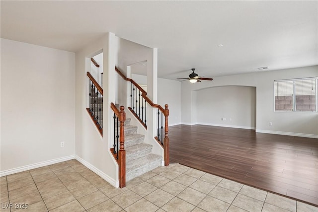5541 Meridian Rain St, North Las Vegas, NV 89031 - stairway with a ceiling fan and wood finished floors