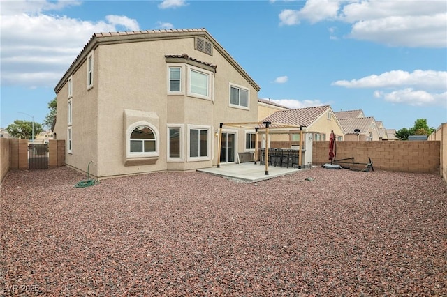 5541 Meridian Rain St, North Las Vegas, NV 89031 - rear view of house featuring a fenced backyard, a patio, and stucco siding