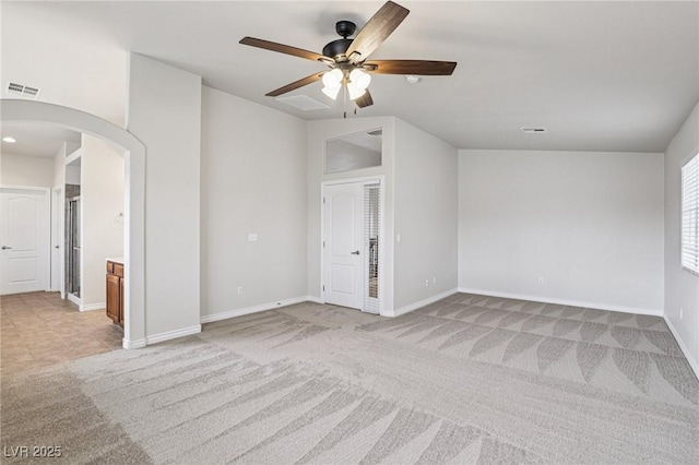 5541 Meridian Rain St, North Las Vegas, NV 89031 - empty room with arched walkways, light carpet, and ceiling fan