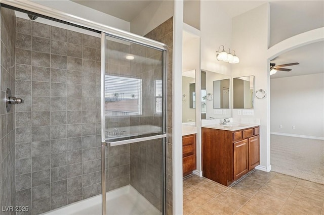 5541 Meridian Rain St, North Las Vegas, NV 89031 - full bathroom featuring a ceiling fan, vanity, a stall shower, and tile patterned floors