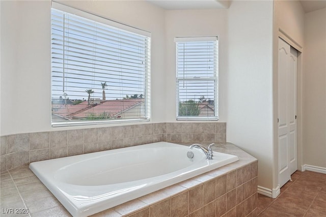 5541 Meridian Rain St, North Las Vegas, NV 89031 - full bathroom with a garden tub, plenty of natural light, and tile patterned floors