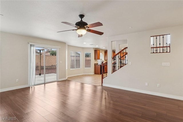5541 Meridian Rain St, North Las Vegas, NV 89031 - unfurnished living room featuring a ceiling fan, stairs, dark wood-type flooring, and recessed lighting