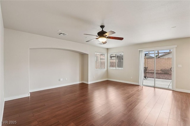 5541 Meridian Rain St, North Las Vegas, NV 89031 - spare room with ceiling fan, arched walkways, and wood finished floors