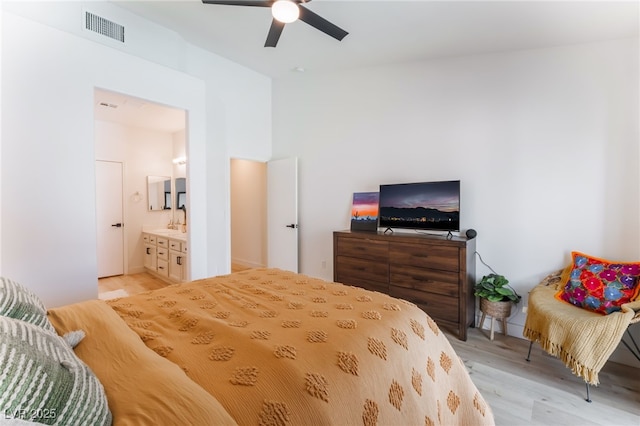 7909 Lovely Pine Pl, Las Vegas, NV 89143 - bedroom with light wood-type flooring, connected bathroom, and ceiling fan