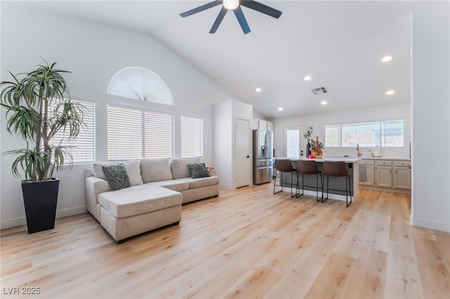 7909 Lovely Pine Pl, Las Vegas, NV 89143 - living area with lofted ceiling, ceiling fan, light wood-style flooring, and recessed lighting