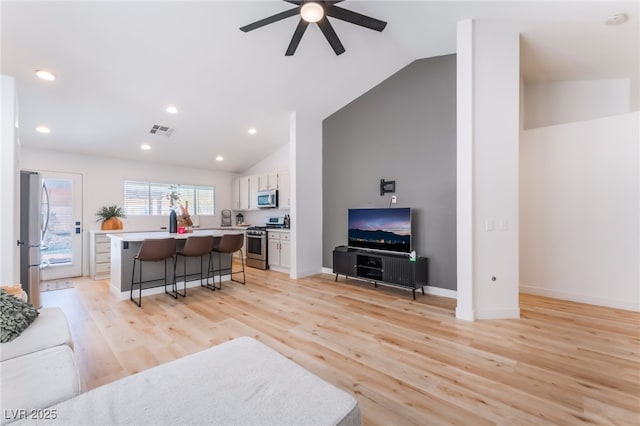 7909 Lovely Pine Pl, Las Vegas, NV 89143 - living room with ceiling fan, light wood finished floors, recessed lighting, and high vaulted ceiling