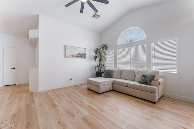 7909 Lovely Pine Pl, Las Vegas, NV 89143 - living room featuring a ceiling fan, vaulted ceiling, healthy amount of natural light, and light wood finished floors