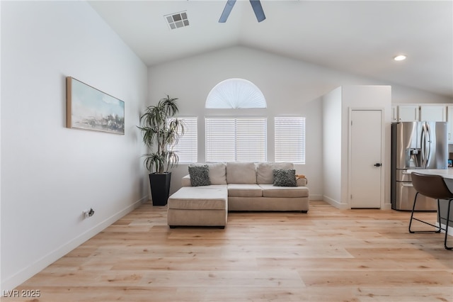 7909 Lovely Pine Pl, Las Vegas, NV 89143 - living room featuring a ceiling fan, lofted ceiling, and light wood-style floors