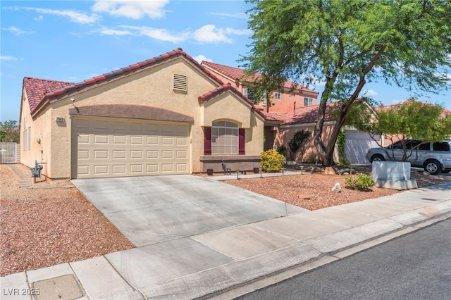7909 Lovely Pine Pl, Las Vegas, NV 89143 - mediterranean / spanish house featuring a tiled roof, stucco siding, and concrete driveway