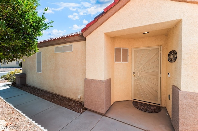 7909 Lovely Pine Pl, Las Vegas, NV 89143 - property entrance featuring stucco siding
