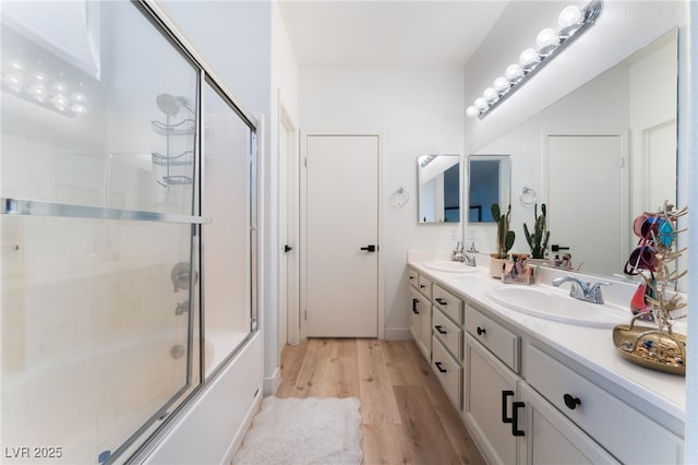 7909 Lovely Pine Pl, Las Vegas, NV 89143 - bathroom with wood finished floors, double vanity, and combined bath / shower with glass door